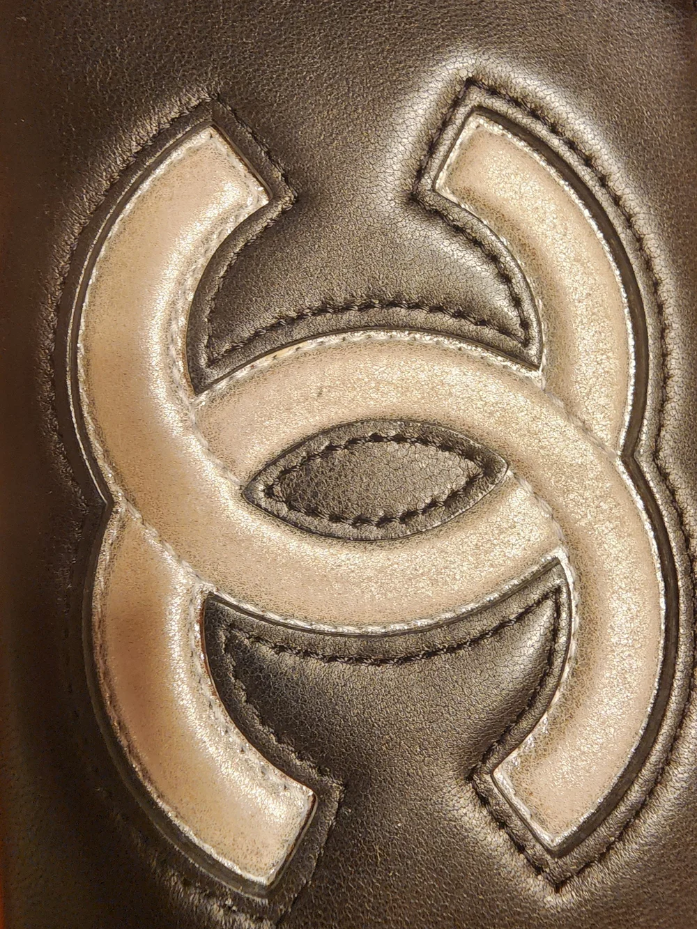 Chanel Timeless CC zip-around wallet features smooth black leather